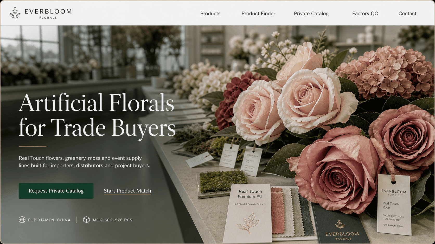 Everbloom showroom table with Real Touch artificial flowers, swatches, and sample tags for trade buyers